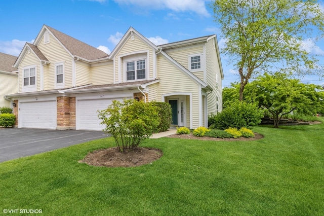 367 S Crown Ct, Palatine, IL 60074 - view of front of house featuring an attached garage, driveway, and a front yard