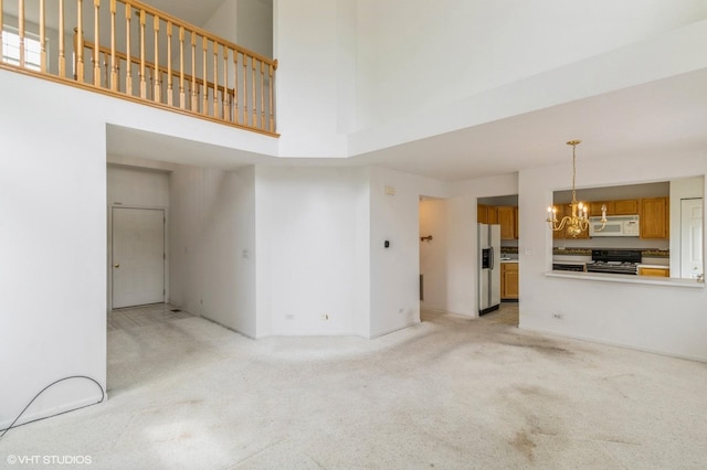 367 S Crown Ct, Palatine, IL 60074 - unfurnished living room with a high ceiling, a chandelier, light carpet, and baseboards