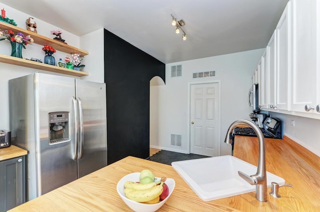 1924 Golden Gate Ln, Naperville, IL 60563 - kitchen featuring appliances with stainless steel finishes, a sink, white cabinets, wooden counters, and open shelves
