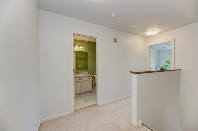 1924 Golden Gate Ln, Naperville, IL 60563 - hall featuring light carpet, an upstairs landing, baseboards, and a sink