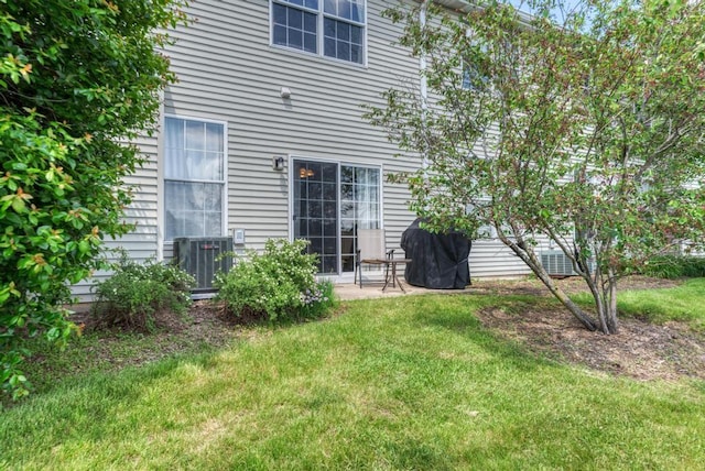 1924 Golden Gate Ln, Naperville, IL 60563 - rear view of property featuring central AC unit and a lawn