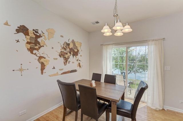 1924 Golden Gate Ln, Naperville, IL 60563 - dining space with a chandelier, light wood-style flooring, and baseboards
