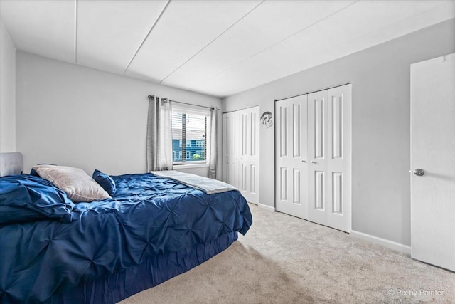 210 E Fountainview Ln Unit 2B, Lombard, IL 60148 - bedroom featuring multiple closets, carpet floors, and baseboards
