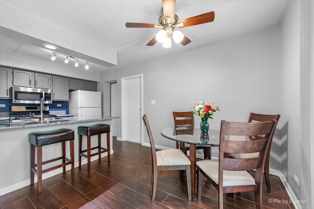 210 E Fountainview Ln Unit 2B, Lombard, IL 60148 - dining area featuring a ceiling fan, dark wood-type flooring, baseboards, and track lighting