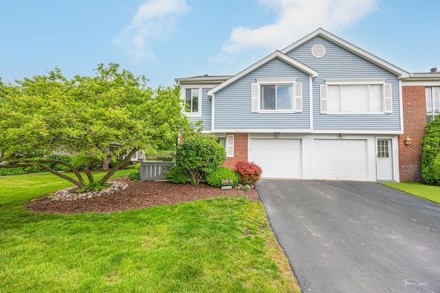 27W314 Melrose Ln, Winfield, IL 60190 - view of front facade with asphalt driveway, an attached garage, brick siding, and a front lawn
