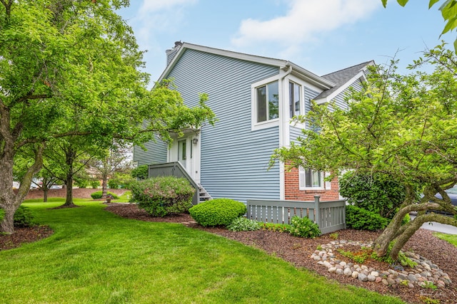 27W314 Melrose Ln, Winfield, IL 60190 - view of property exterior featuring a lawn and a chimney