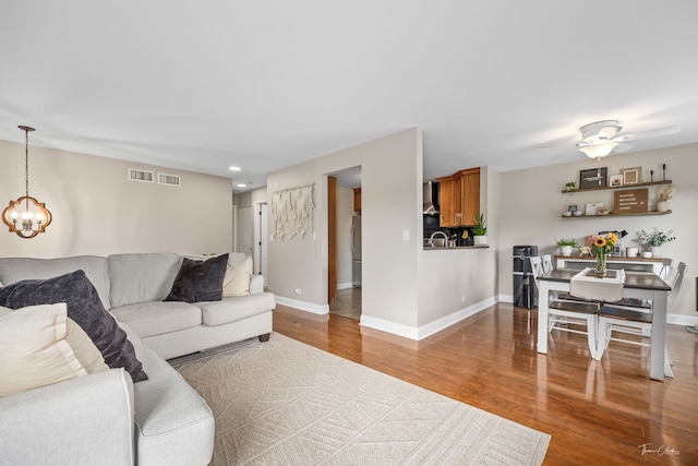 27W314 Melrose Ln, Winfield, IL 60190 - living area featuring wood finished floors, baseboards, a chandelier, ceiling fan, and recessed lighting