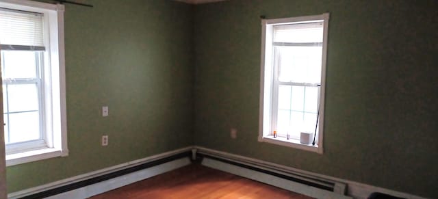 809 S Lynn St, Champaign, IL 61820 - spare room with wood finished floors and baseboards