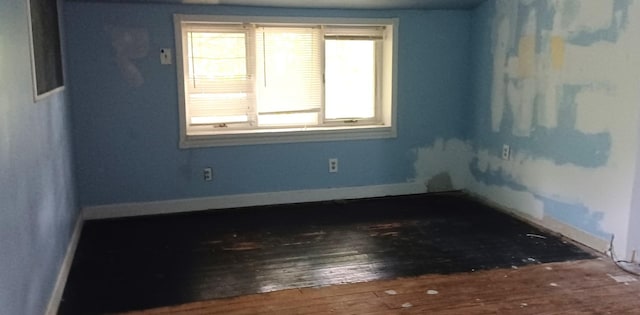 809 S Lynn St, Champaign, IL 61820 - spare room featuring wood-type flooring