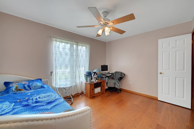 1565 Stefanie Ln, Bourbonnais, IL 60914 - bedroom with light wood finished floors, baseboards, and a ceiling fan