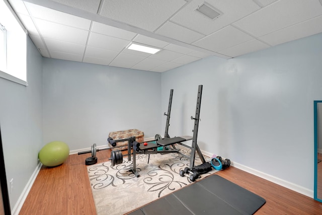 1565 Stefanie Ln, Bourbonnais, IL 60914 - exercise room featuring wood finished floors, a drop ceiling, and baseboards