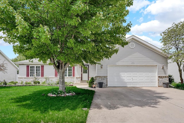 1565 Stefanie Ln, Bourbonnais, IL 60914 - obstructed view of property featuring an attached garage, concrete driveway, a front yard, and stone siding