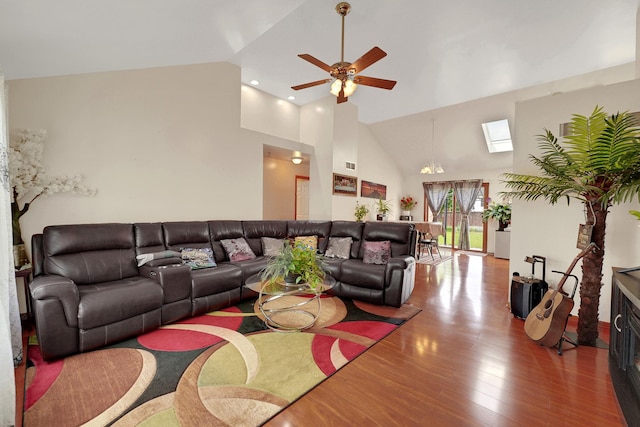 1565 Stefanie Ln, Bourbonnais, IL 60914 - living area with a skylight, high vaulted ceiling, a ceiling fan, and wood finished floors