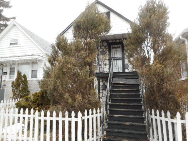 8548 S Marquette Ave, Chicago, IL 60617 - view of front of house featuring stairway and stone siding