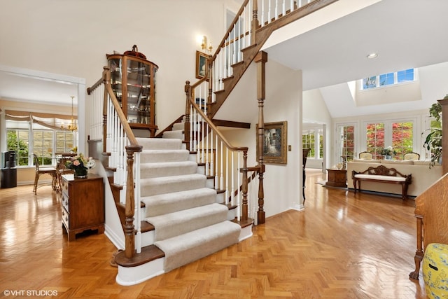 289 S S Shore Ln, Lake Forest, IL 60045 - stairway with healthy amount of natural light, a high ceiling, baseboards, a chandelier, and recessed lighting