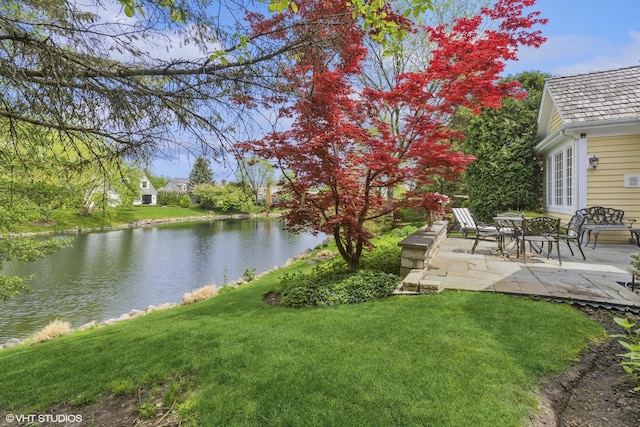 289 S S Shore Ln, Lake Forest, IL 60045 - view of green lawn with a water view and a patio