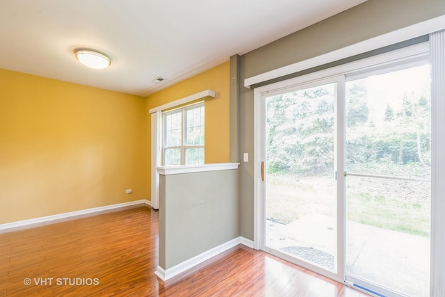 1418 W Split Oak Cir Unit 1418, Round Lake Beach, IL 60073 - doorway with wood finished floors and baseboards