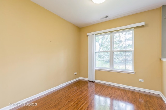 1418 W Split Oak Cir Unit 1418, Round Lake Beach, IL 60073 - unfurnished room with wood finished floors and baseboards