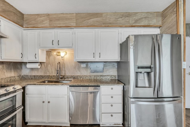 8801 W Golf Rd Unit 10C, Niles, IL 60714 - kitchen featuring stainless steel appliances, a sink, white cabinetry, stone counters, and tasteful backsplash