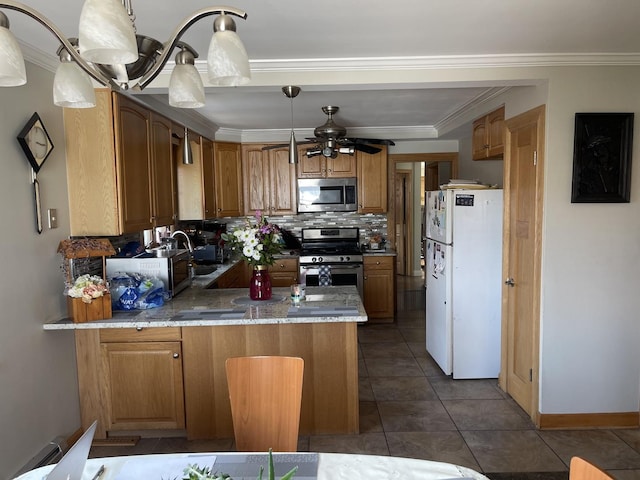4549 N Canfield Ave, Norridge, IL 60706 - kitchen with appliances with stainless steel finishes, a peninsula, tasteful backsplash, light stone countertops, and ceiling fan