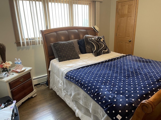 4549 N Canfield Ave, Norridge, IL 60706 - bedroom with baseboard heating and wood finished floors