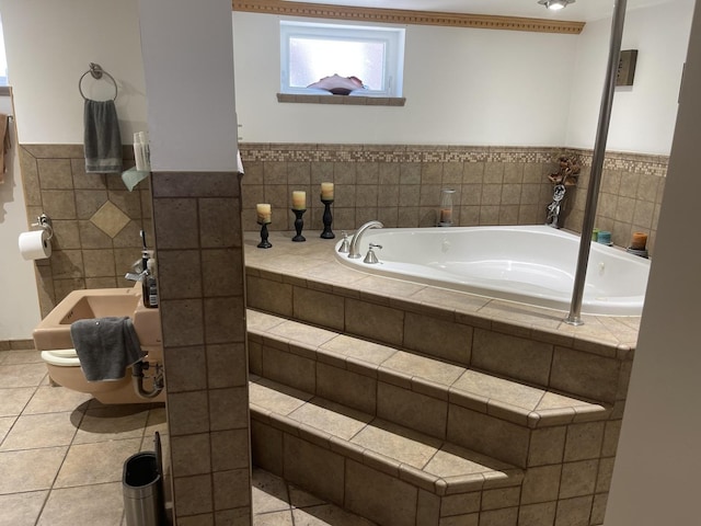 4549 N Canfield Ave, Norridge, IL 60706 - bathroom featuring a garden tub, tile patterned floors, wainscoting, and tile walls