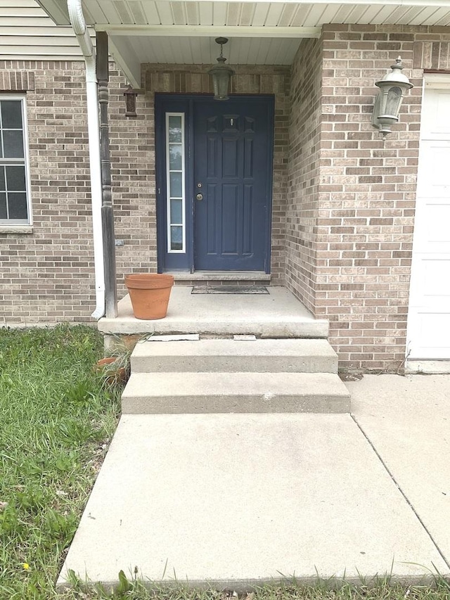 934 Evans St, Ottawa, IL 61350 - property entrance featuring a garage and brick siding