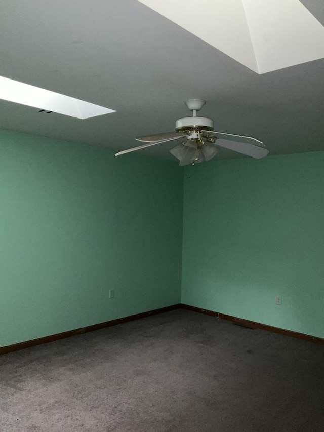 934 Evans St, Ottawa, IL 61350 - carpeted spare room with a skylight, a ceiling fan, and baseboards