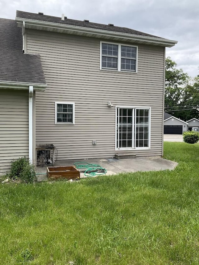 934 Evans St, Ottawa, IL 61350 - rear view of house with a lawn and a patio