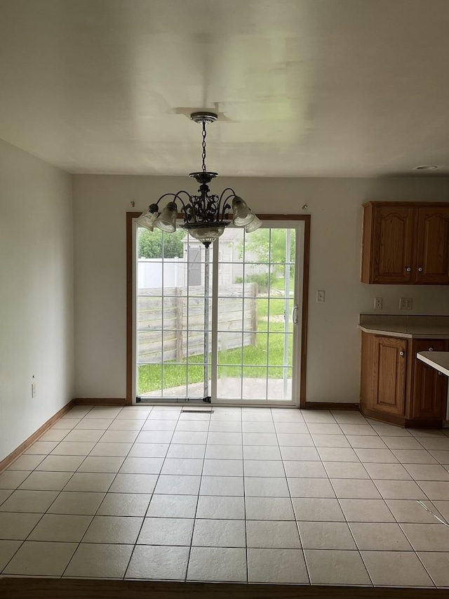 934 Evans St, Ottawa, IL 61350 - unfurnished dining area with a chandelier, healthy amount of natural light, and light tile patterned floors