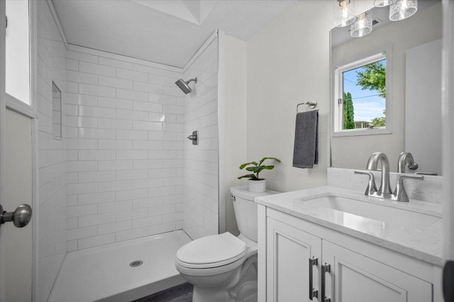 824 Mcgregor St Unit 4, Bloomington, IL 61701 - full bath with vanity, a tile shower, and a textured ceiling
