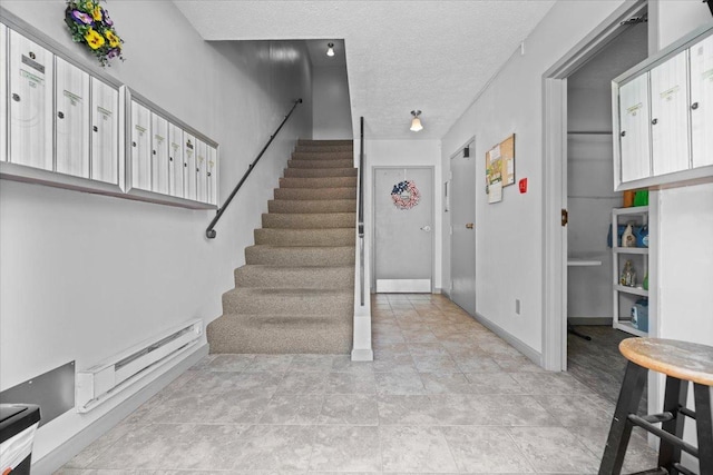 824 Mcgregor St Unit 4, Bloomington, IL 61701 - stairs featuring a baseboard radiator and a textured ceiling