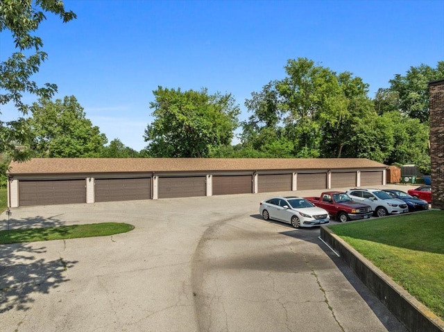 824 Mcgregor St Unit 4, Bloomington, IL 61701 - view of front of house with community garages and a front yard