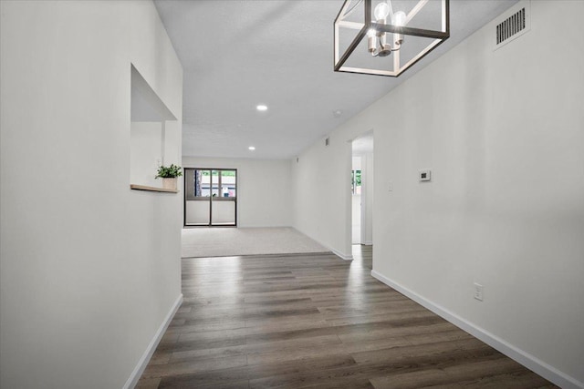 824 Mcgregor St Unit 4, Bloomington, IL 61701 - spare room with wood finished floors, recessed lighting, and a chandelier