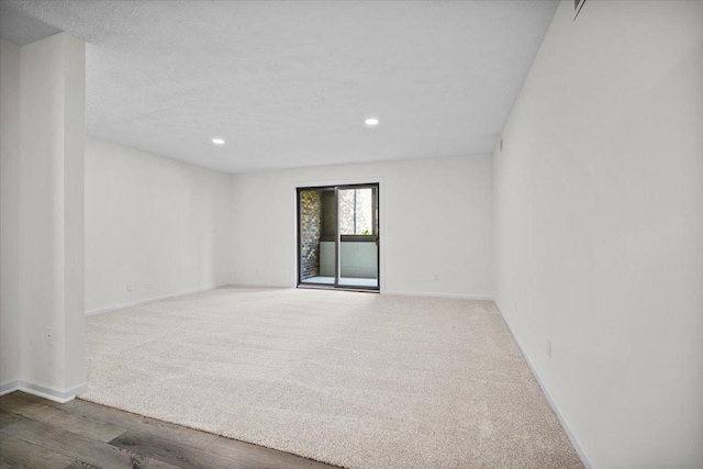 824 Mcgregor St Unit 4, Bloomington, IL 61701 - empty room featuring recessed lighting, carpet floors, and wood finished floors