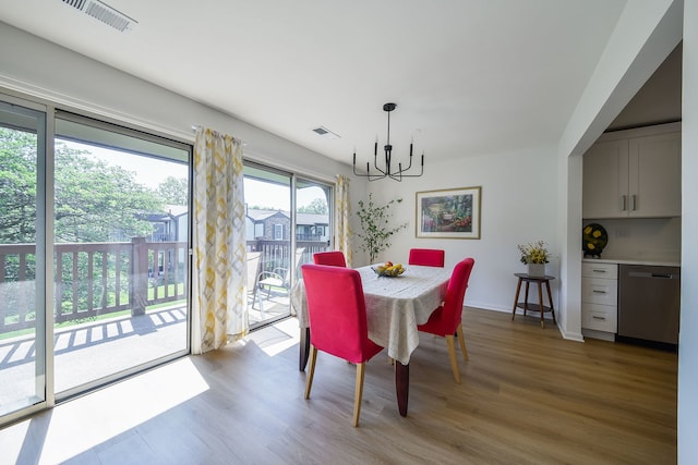 42 Plymouth Ct Unit 202B, Naperville, IL 60565 - dining room with a chandelier and wood finished floors