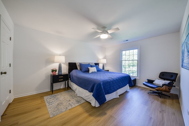 42 Plymouth Ct Unit 202B, Naperville, IL 60565 - bedroom featuring wood finished floors, baseboards, and ceiling fan