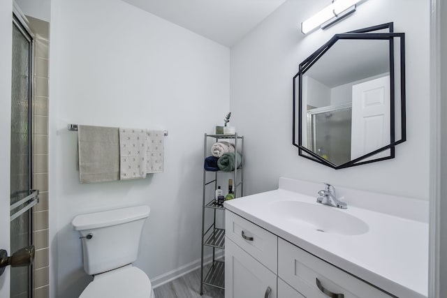 42 Plymouth Ct Unit 202B, Naperville, IL 60565 - bathroom featuring vanity, toilet, an enclosed shower, and baseboards