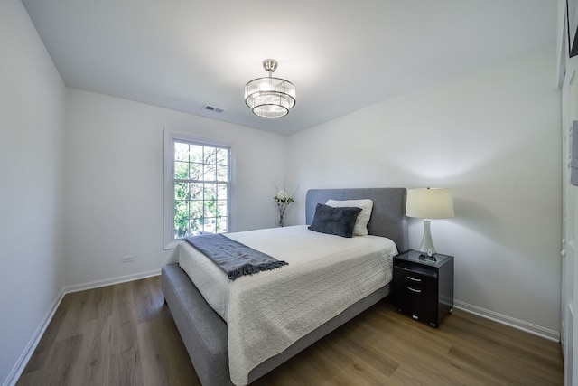 42 Plymouth Ct Unit 202B, Naperville, IL 60565 - bedroom featuring wood finished floors and baseboards