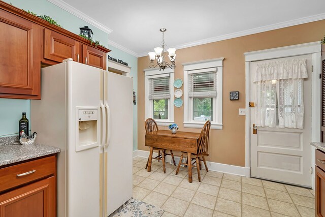 810 Glenwood Ave, Joliet, IL 60435 - kitchen featuring white refrigerator with ice dispenser, a chandelier, brown cabinetry, crown molding, and pendant lighting