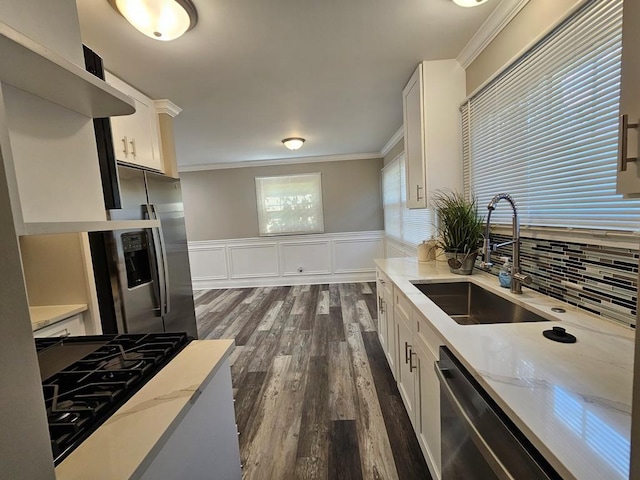 36586 N Traer Ter, Gurnee, IL 60031 - kitchen featuring a sink, crown molding, stainless steel appliances, light stone countertops, and dark wood-type flooring