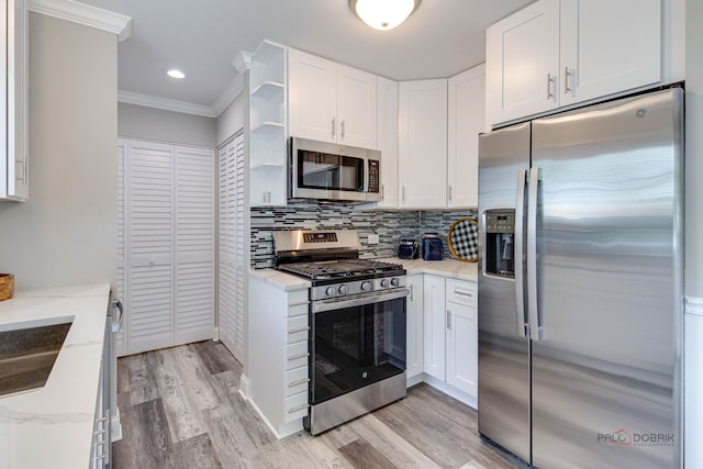 36586 N Traer Ter, Gurnee, IL 60031 - kitchen with appliances with stainless steel finishes, light wood-style flooring, white cabinetry, light stone counters, and ornamental molding