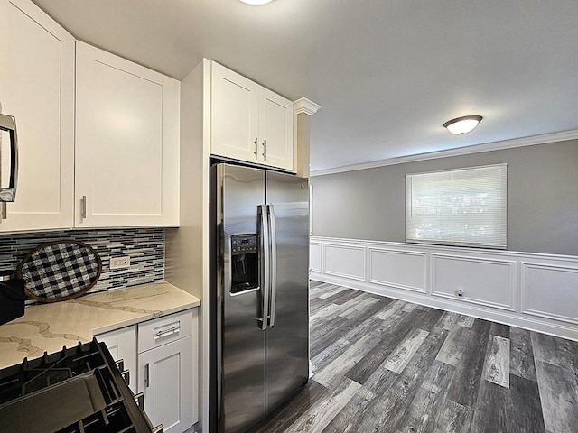 36586 N Traer Ter, Gurnee, IL 60031 - kitchen with appliances with stainless steel finishes, white cabinetry, crown molding, dark wood-type flooring, and light stone counters