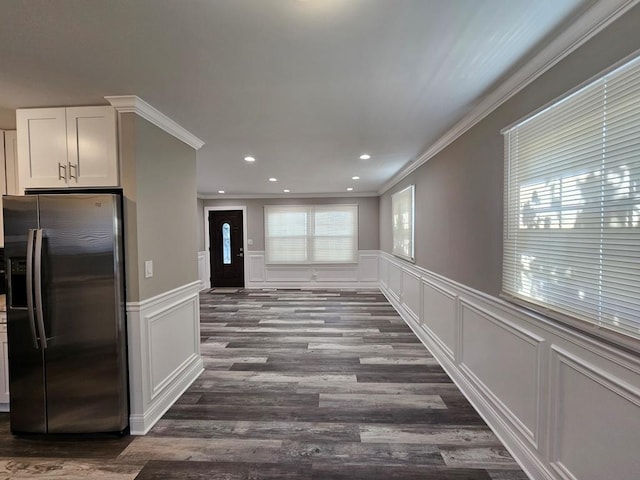 36586 N Traer Ter, Gurnee, IL 60031 - unfurnished dining area featuring crown molding, a decorative wall, dark wood-style flooring, a wainscoted wall, and recessed lighting