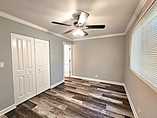 36586 N Traer Ter, Gurnee, IL 60031 - unfurnished bedroom with dark wood-type flooring, a closet, baseboards, and ornamental molding