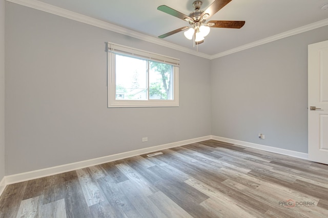 36586 N Traer Ter, Gurnee, IL 60031 - empty room featuring wood finished floors, ceiling fan, ornamental molding, and a smoke detector