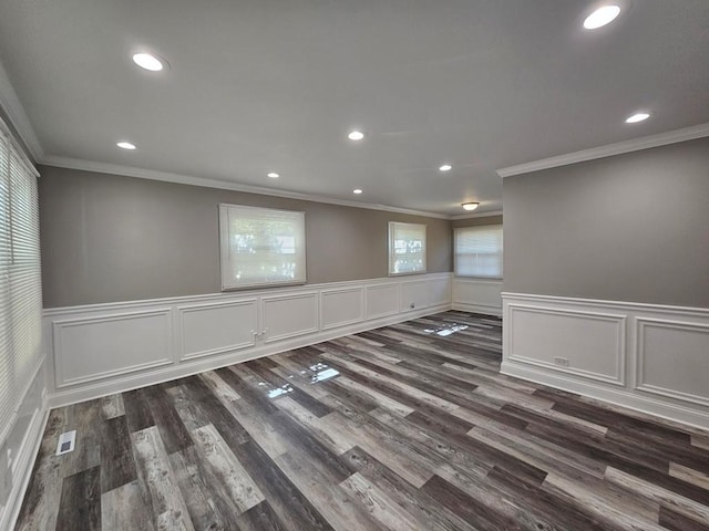 36586 N Traer Ter, Gurnee, IL 60031 - empty room featuring crown molding, recessed lighting, dark wood-style floors, and wainscoting