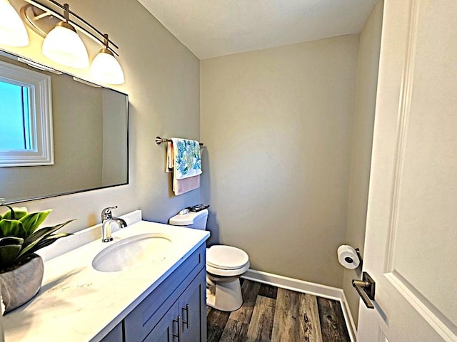 36586 N Traer Ter, Gurnee, IL 60031 - bathroom featuring toilet, wood finished floors, vanity, and baseboards