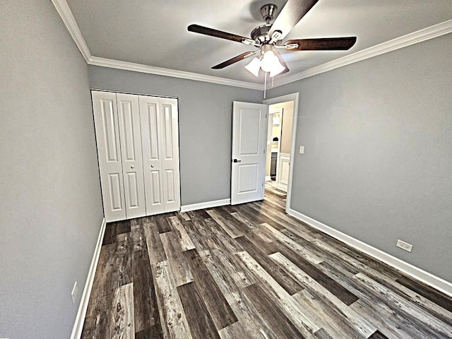 36586 N Traer Ter, Gurnee, IL 60031 - unfurnished bedroom with dark wood-type flooring, baseboards, crown molding, a closet, and ceiling fan
