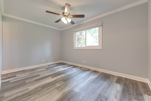36586 N Traer Ter, Gurnee, IL 60031 - spare room featuring wood finished floors, a ceiling fan, and crown molding